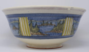 Side view of Handmade and hand painted Ceramic Slipware Serving Bowl 32 cm x 32 cm x 14 cm With exterior panel paintings of a Canadian Landscapes, Northern Lake scenes with Blue banding green stripes decoration. by Sean Robinson Ceramics